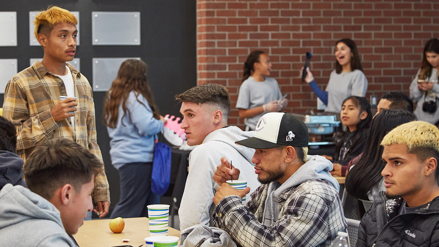 Students gather in advance of a brown bag lunch event with the Interim Superintendent/President.