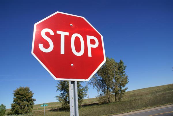 Stop sign against a blue sky