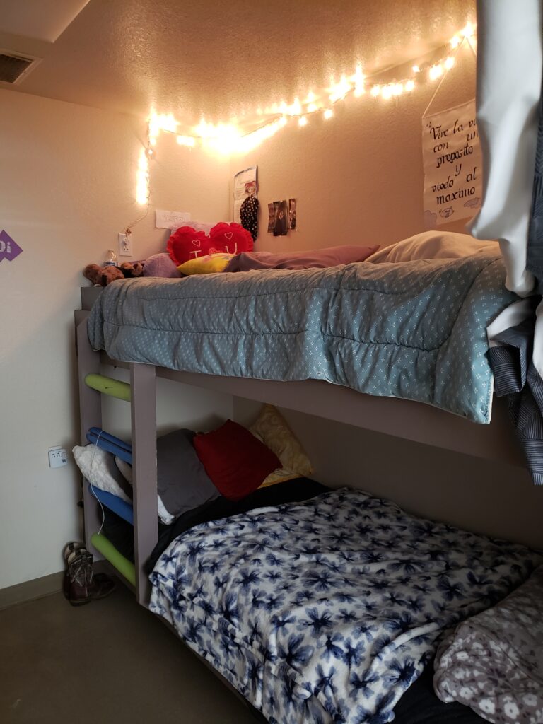A set of bunk beds in a dorm room