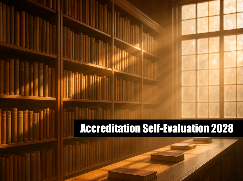Accreditation Self-Evaluation 2028 image of books in a library indicating that we studied something.